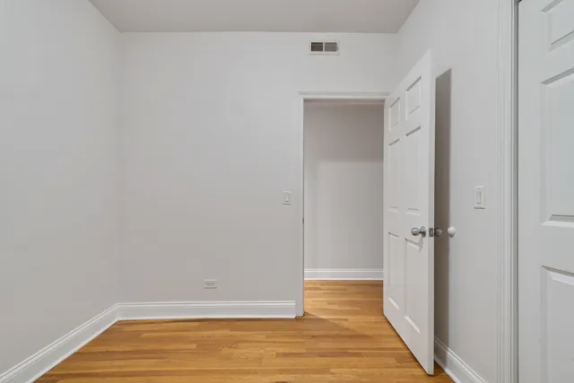 a view of room with wooden floor