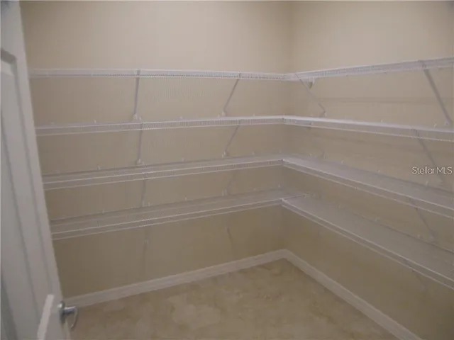 a empty closet with white paint