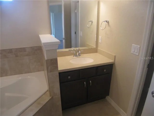 a bathroom with a sink and a bathtub