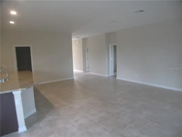 a view of an empty room with a bathroom