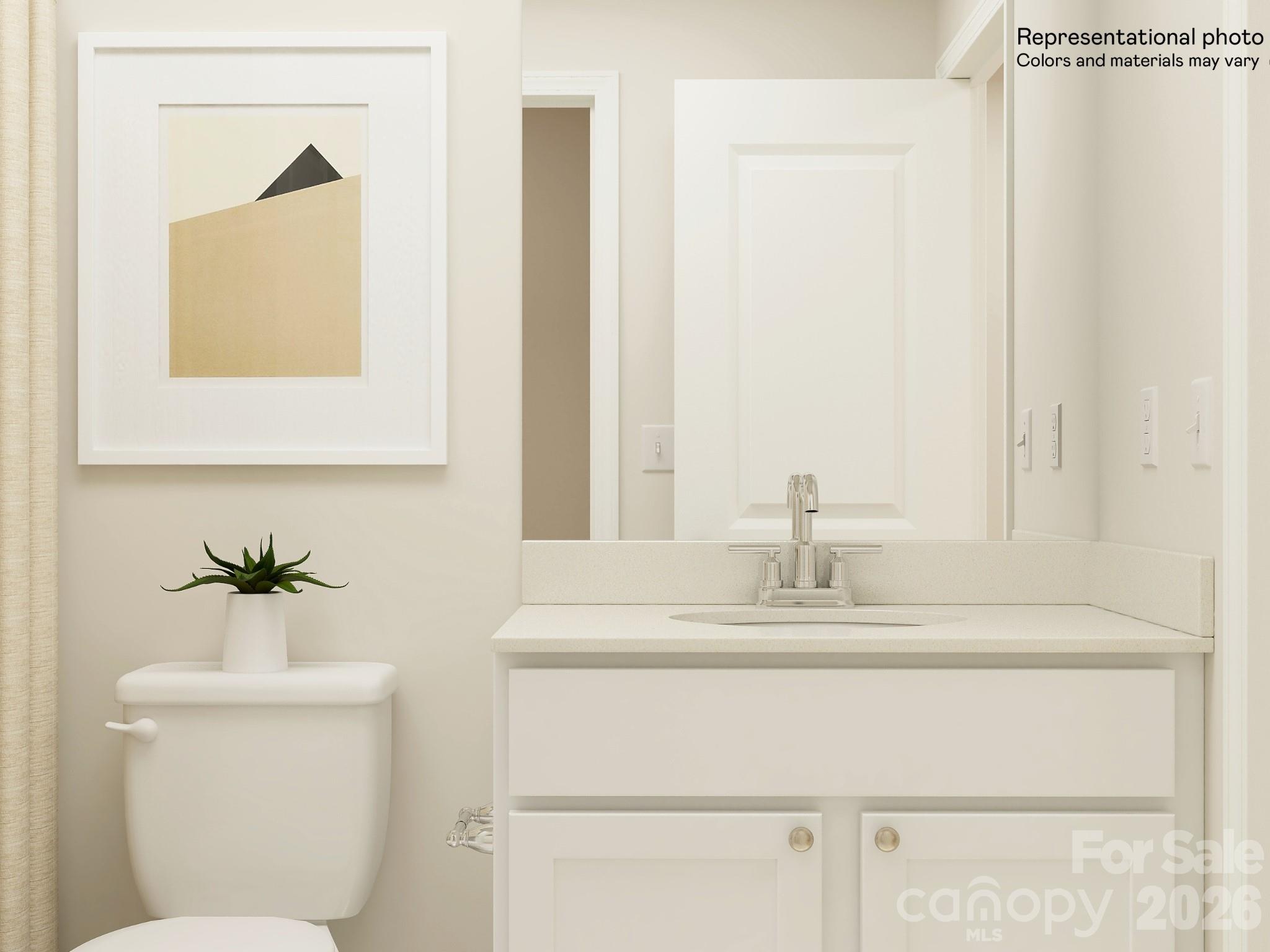 5451 Redbud Road, Unit 52 Lancaster, SC 29720 - Photo 9 of 22 a bathroom with a sink toilet and mirror