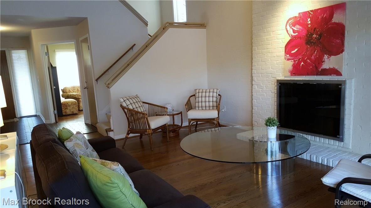 7226 Suncrest Road West Bloomfield, MI 48322 - Photo 17 of 44 Extra high ceilings in living room with lovely architectual design and fireplace