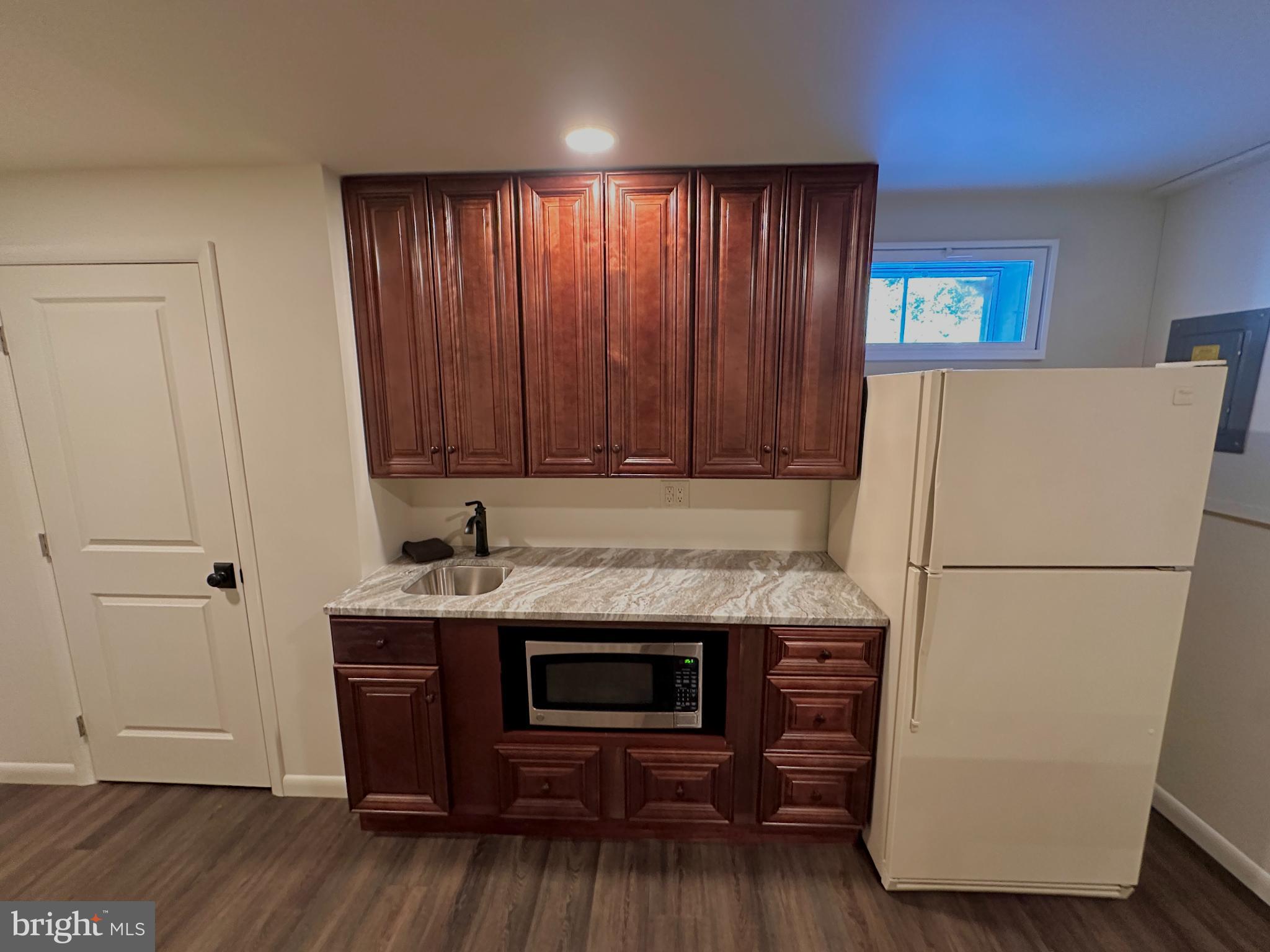 701 Tamarack Trail Reading, PA 19607 - Photo 27 of 32 Charming kitchen with rich wood cabinetry.