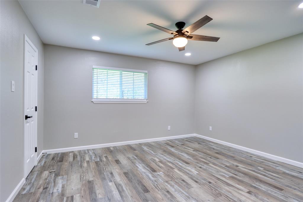 111 Kay Drive Robinson, TX 76706 - Photo 14 of 40 wooden floor in an empty room with a window