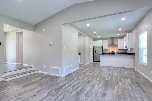 a aerial view of a house with a yard