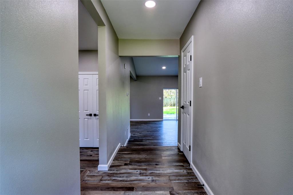 111 Kay Drive Robinson, TX 76706 - Photo 7 of 40 a view of a hallway with wooden floor and staircase