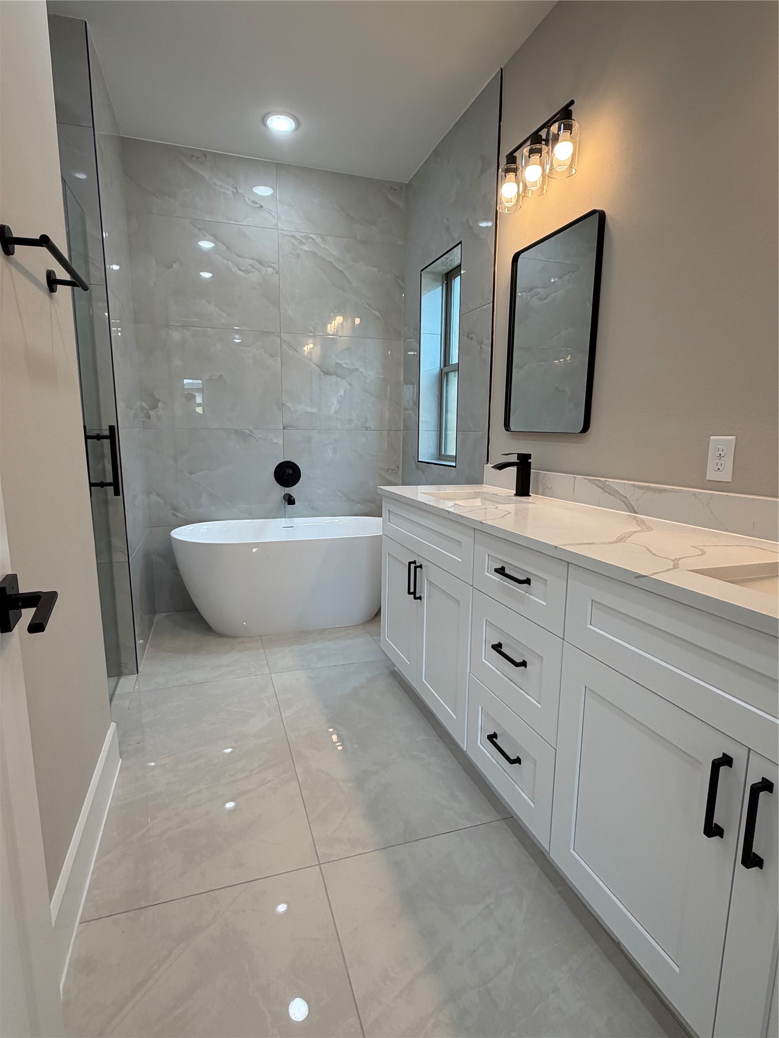 2514 Liguria Lane Spring, TX 77388 - Photo 17 of 25 a bathroom with a double vanity sink mirror and bathtub