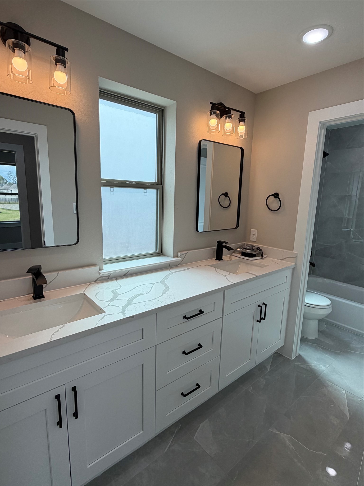 2514 Liguria Lane Spring, TX 77388 - Photo 25 of 25 a bathroom with a double vanity sink and a mirror