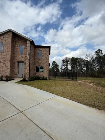 a view of house with yard