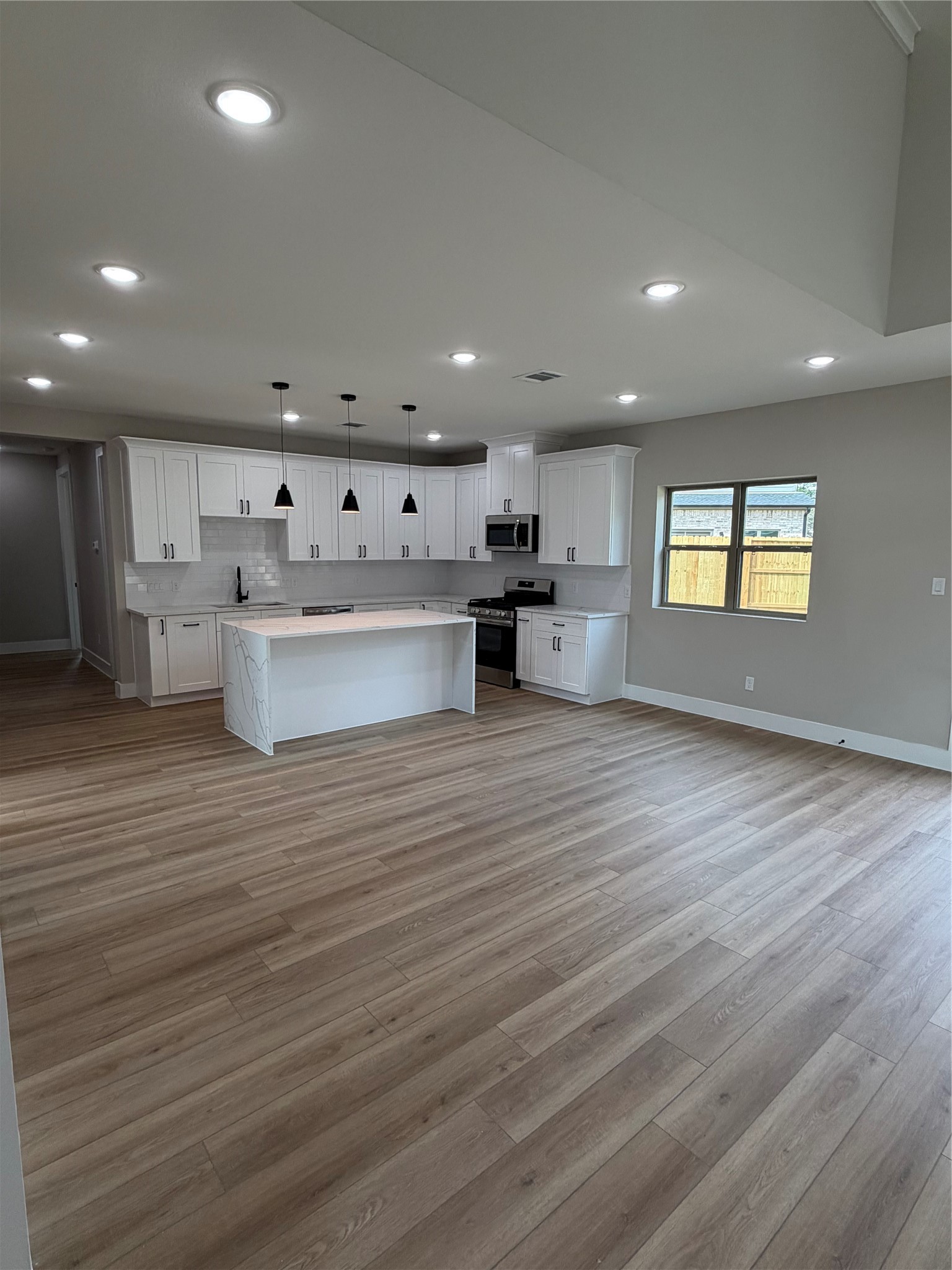 2514 Liguria Lane Spring, TX 77388 - Photo 5 of 25 a view of kitchen with cabinets and wooden floor