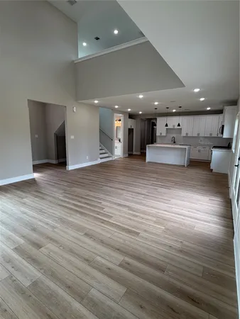 a view of a kitchen with kitchen island a counter top space and cabinets