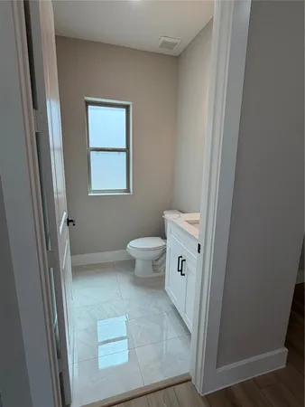 a bathroom with a toilet and a sink