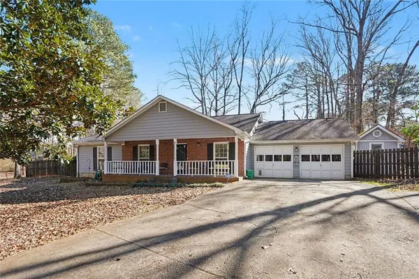 front view of a house with a yard