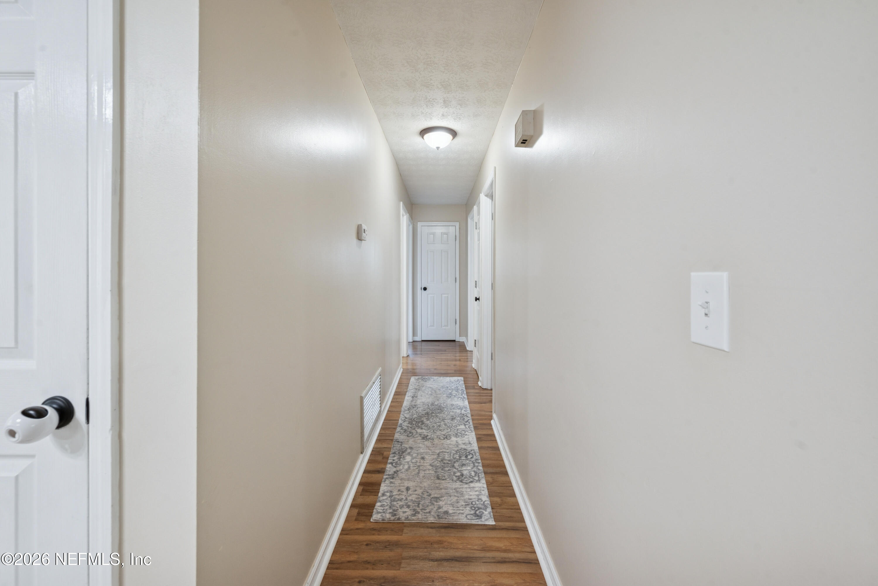 240 Highway 16 Starke, FL 32091 - Photo 11 of 32 a view of a hallway with wooden floor