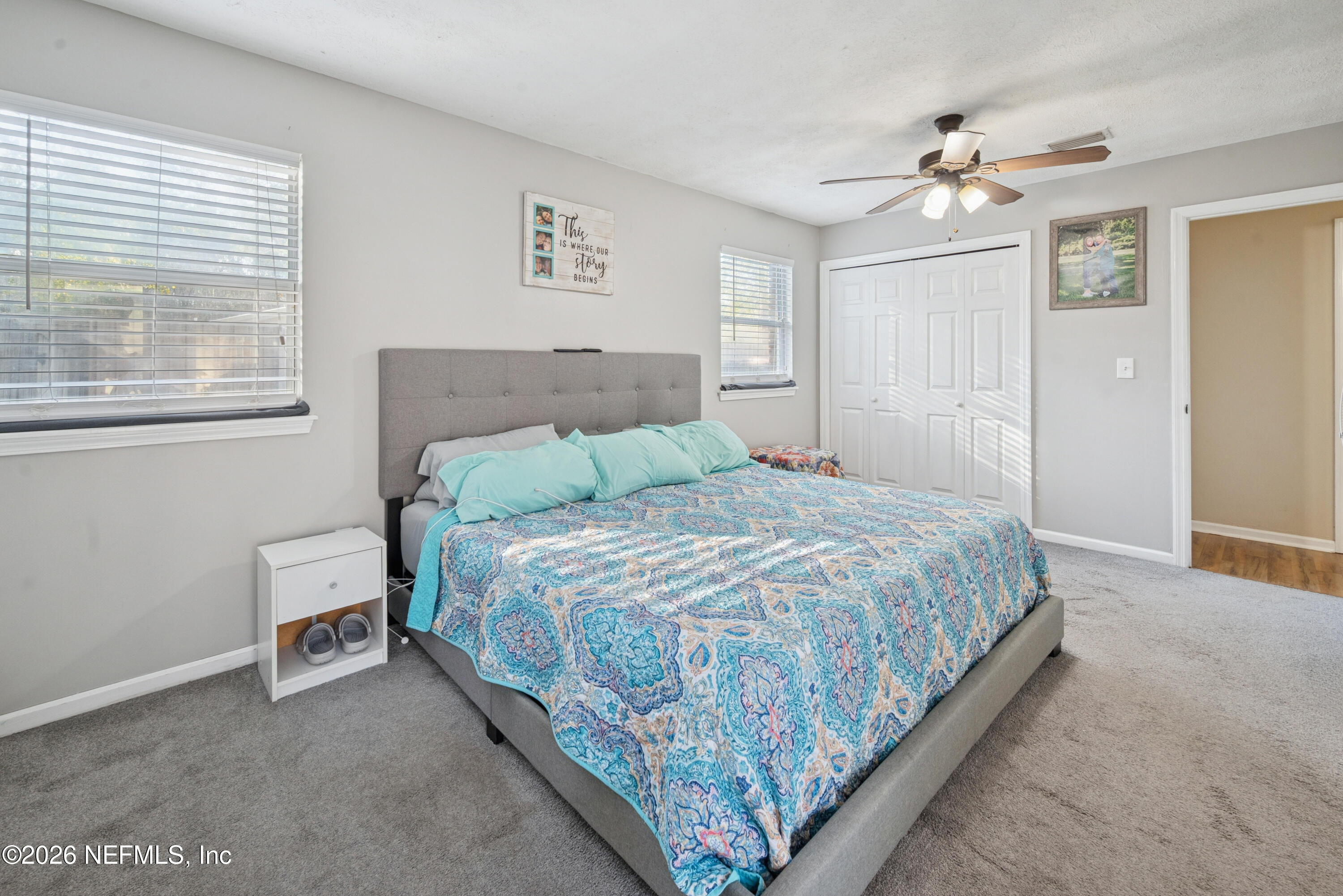 240 Highway 16 Starke, FL 32091 - Photo 14 of 32 a bedroom with a bed and a chandelier