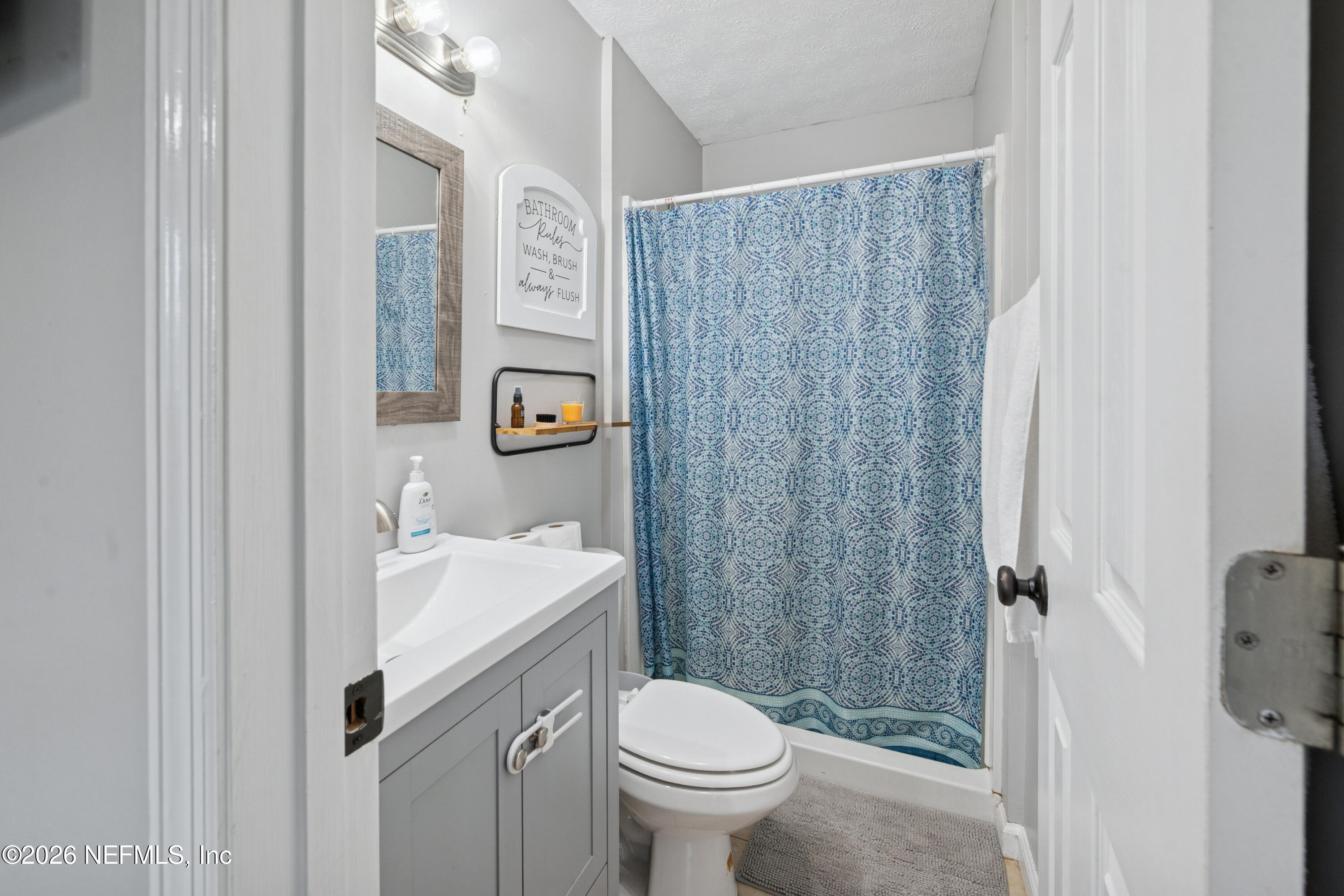 240 Highway 16 Starke, FL 32091 - Photo 16 of 32 a bathroom with a sink toilet and shower