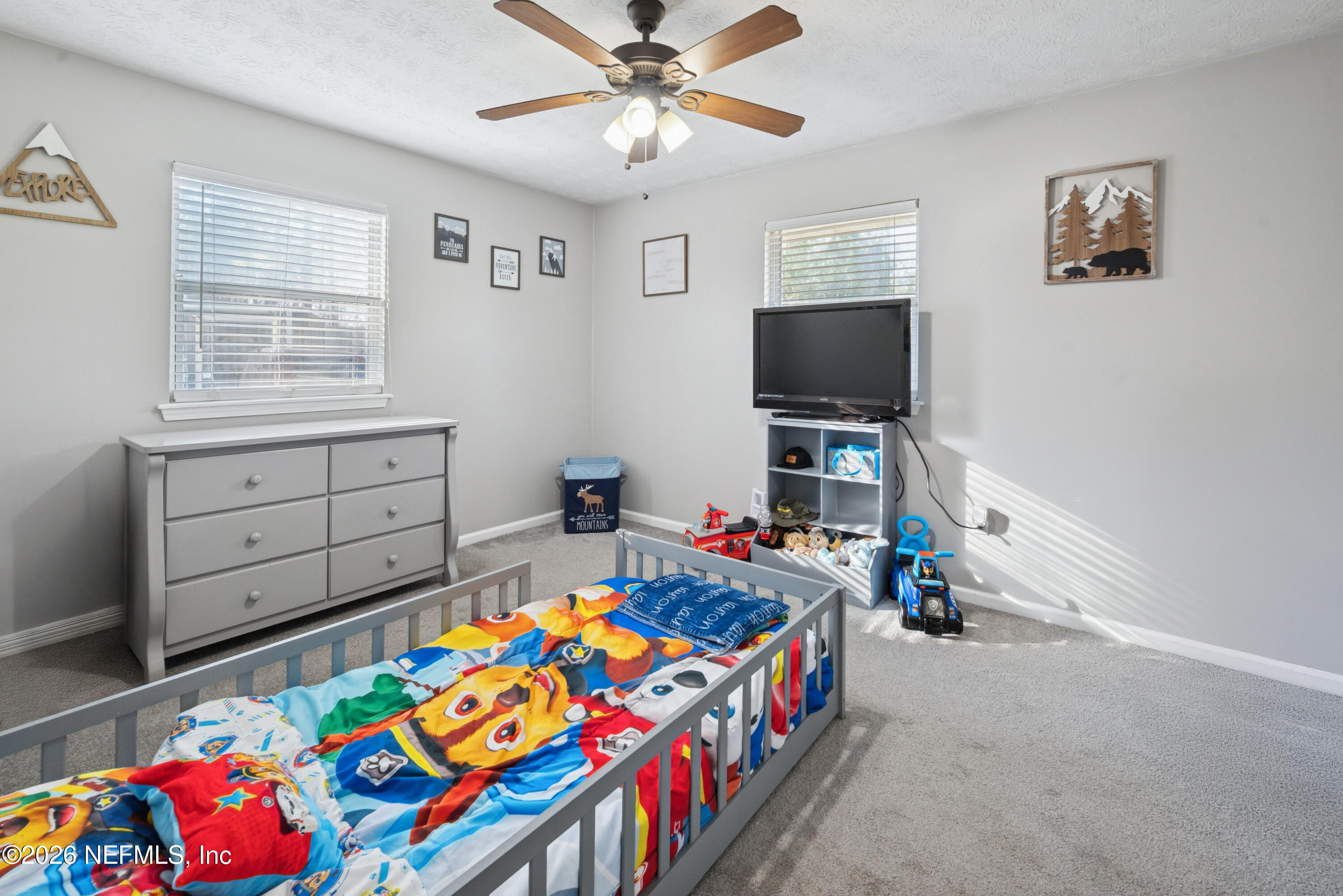 240 Highway 16 Starke, FL 32091 - Photo 20 of 32 a bedroom with furniture a baby crib and a window