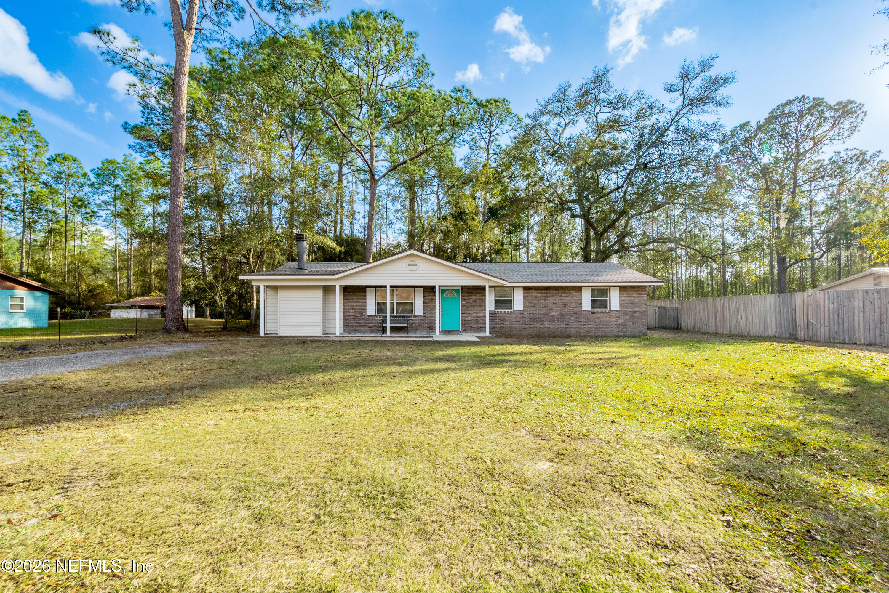 240 Highway 16 Starke, FL 32091 - Photo 2 of 32 a view of a swimming pool with an outdoor seating and a yard