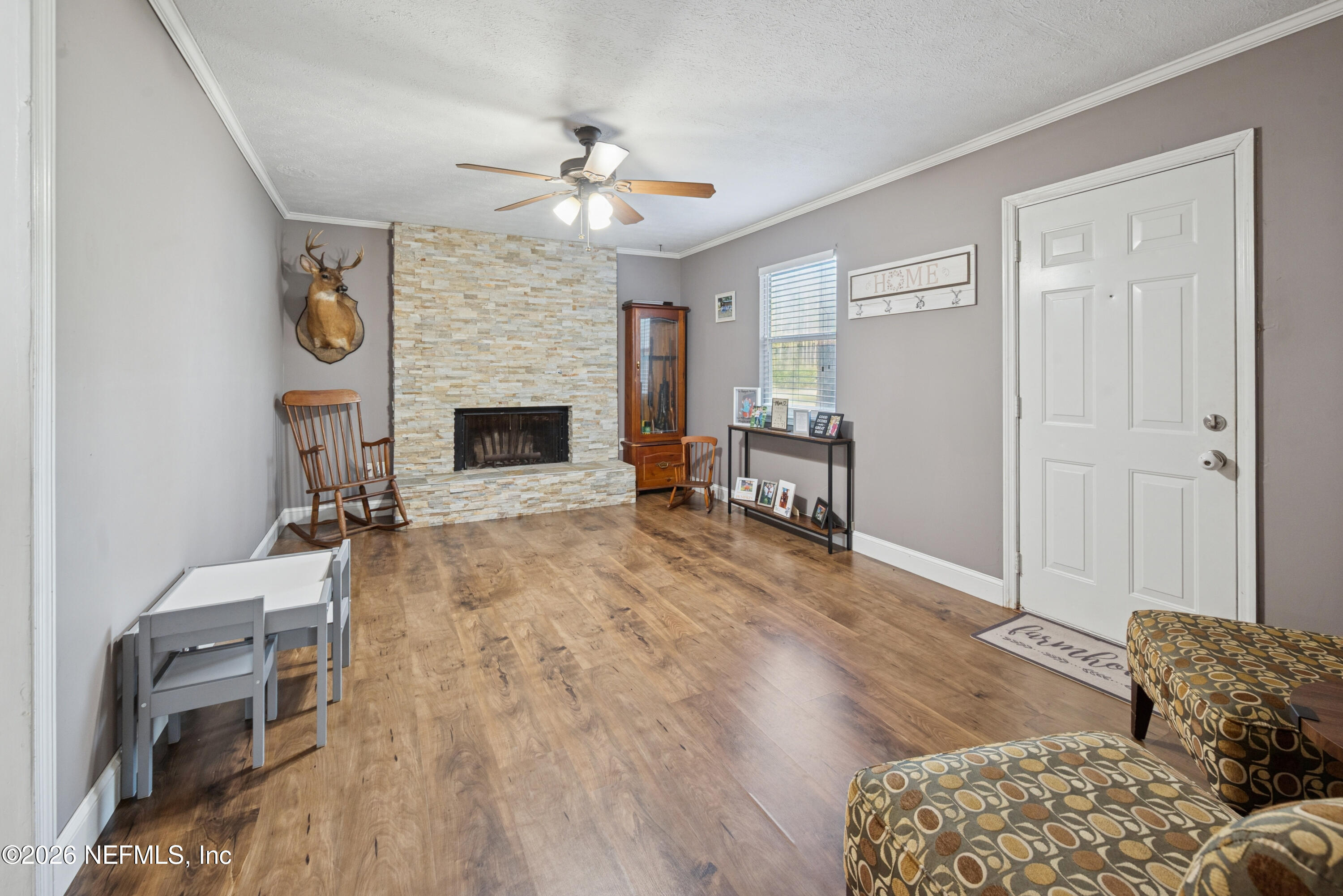240 Highway 16 Starke, FL 32091 - Photo 24 of 32 a living room with furniture and a fireplace