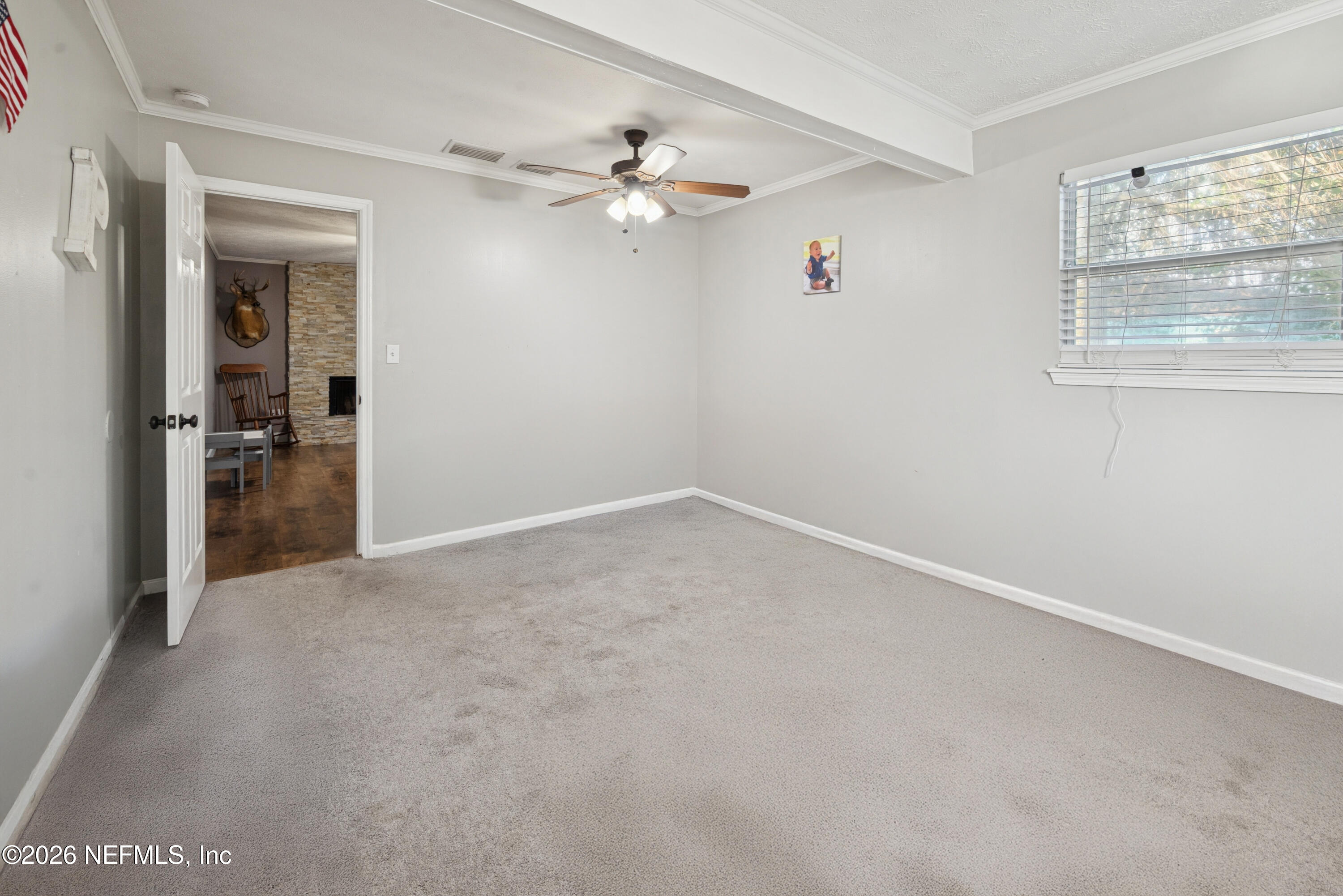 240 Highway 16 Starke, FL 32091 - Photo 27 of 32 wooden floor in an empty room with a window