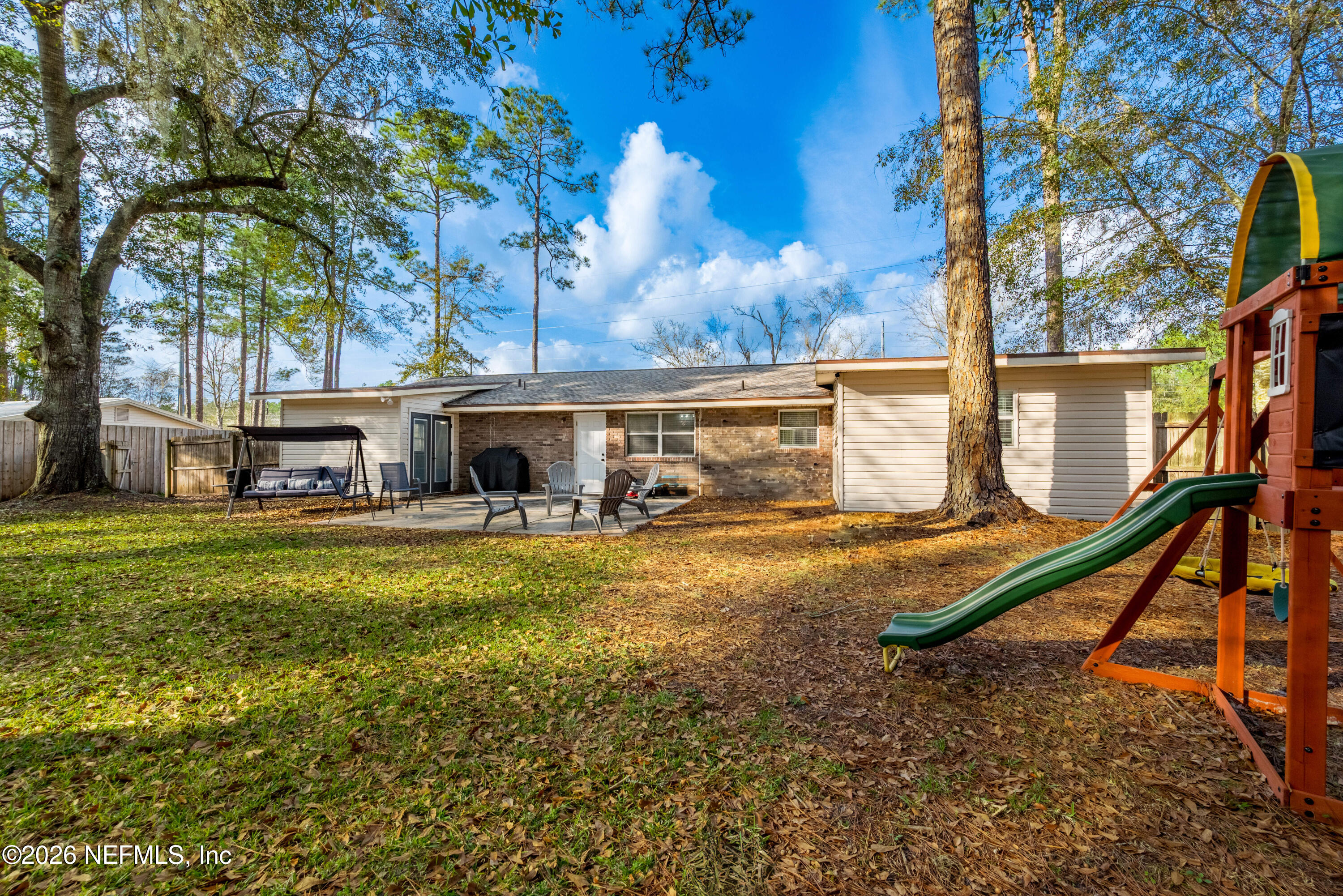 240 Highway 16 Starke, FL 32091 - Photo 30 of 32 a backyard of a house with table and chairs