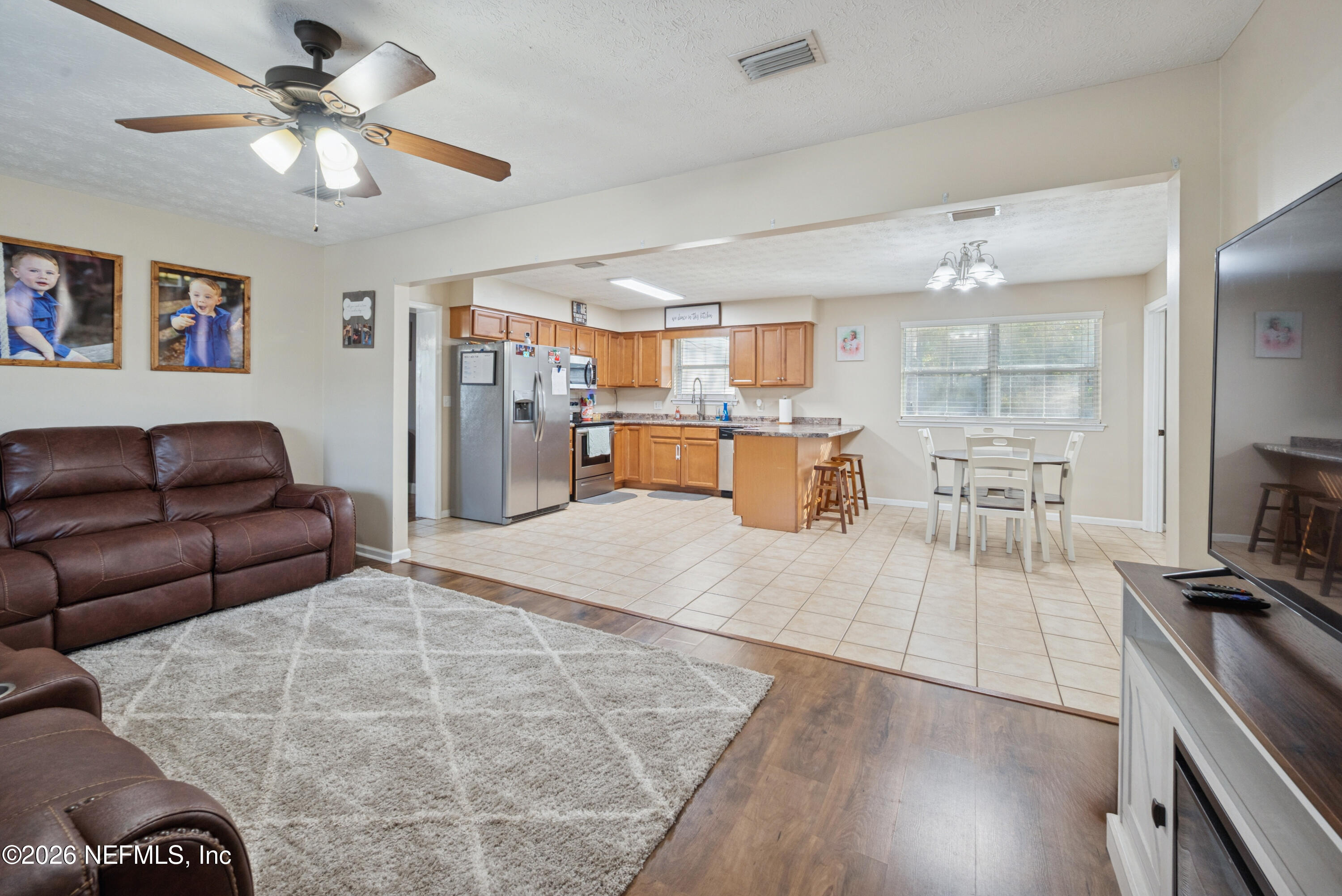 240 Highway 16 Starke, FL 32091 - Photo 3 of 32 a living room with furniture and kitchen view