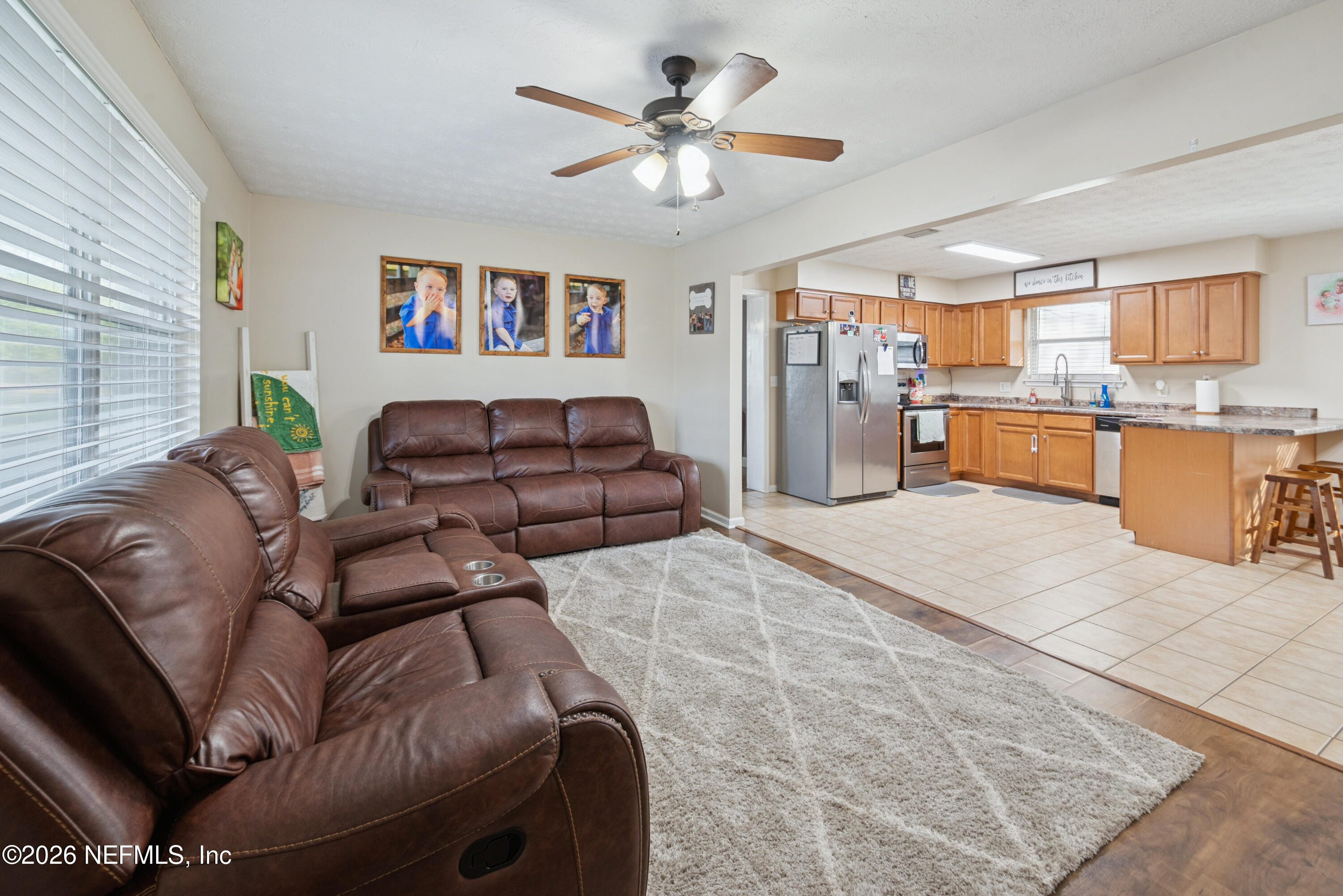 240 Highway 16 Starke, FL 32091 - Photo 4 of 32 a living room with furniture and kitchen view