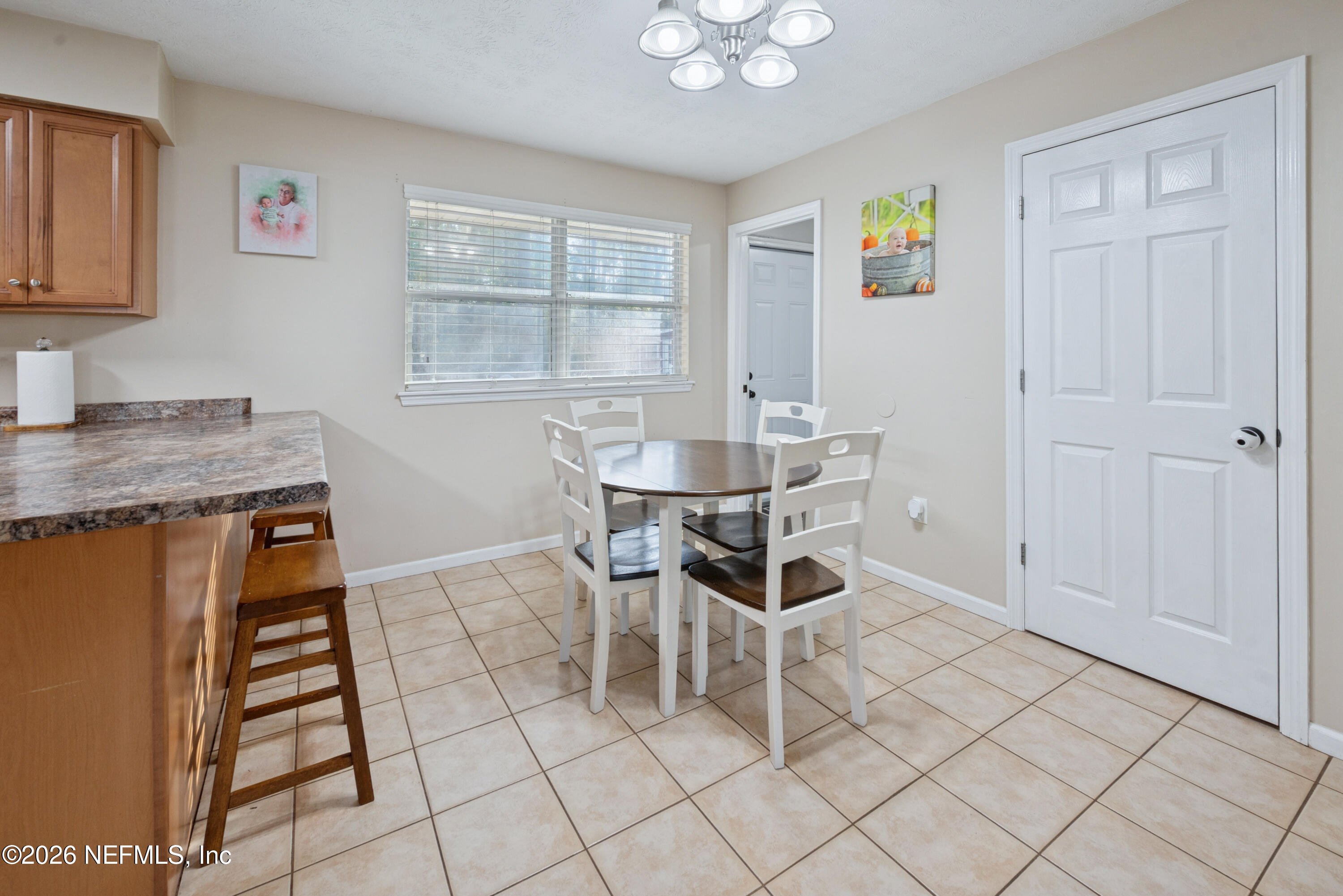 240 Highway 16 Starke, FL 32091 - Photo 10 of 32 a dining room with chandelier and window