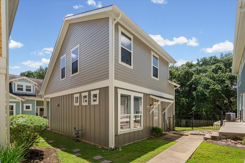 12200 Tawny Farms Road, Unit 139 Austin, TX 78748 - Photo 23 of 30 Moving around to the side of the home, you have a dedicated concrete pathway leading right to a side entry door, which is perfect for bringing in groceries or giving guests a separate entrance.