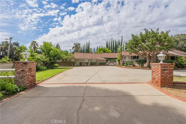 a view of outdoor space building and tree in back