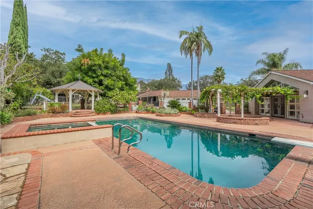 a view of a swimming pool with a patio