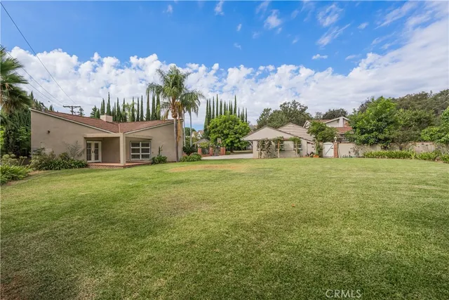 a view of a house with a big yard