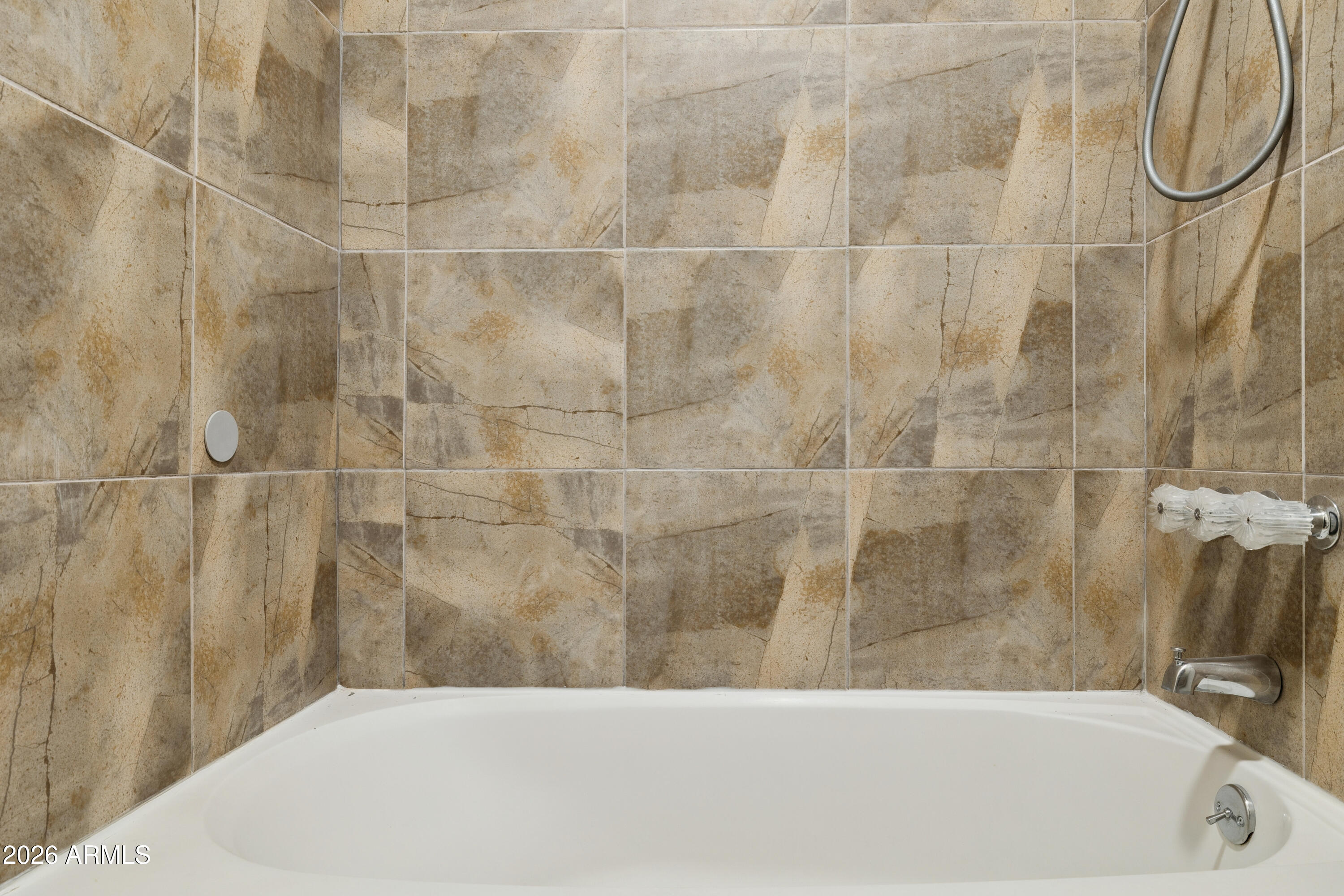4343 East Osborn Road Phoenix, AZ 85018 - Photo 14 of 41 a bathroom with a bathtub