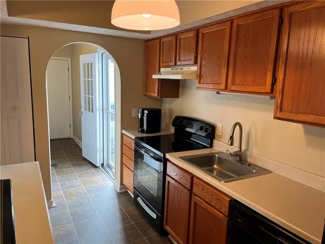 a bedroom with bed and a night stand