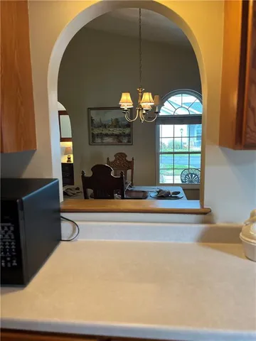 a bedroom with a bed and a tv on the dresser