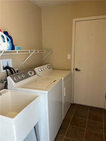 a living room with a bed and a dresser