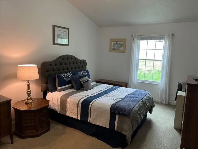 a bathroom with a shower curtain and toilet