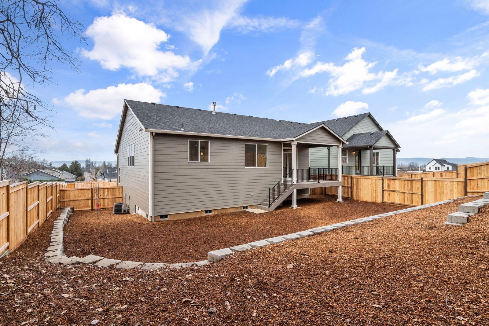 669 Old Waverly Way, Unit 20 Eagle Point, OR 97524 - Photo 29 of 32 a view of a house with backyard and sitting area