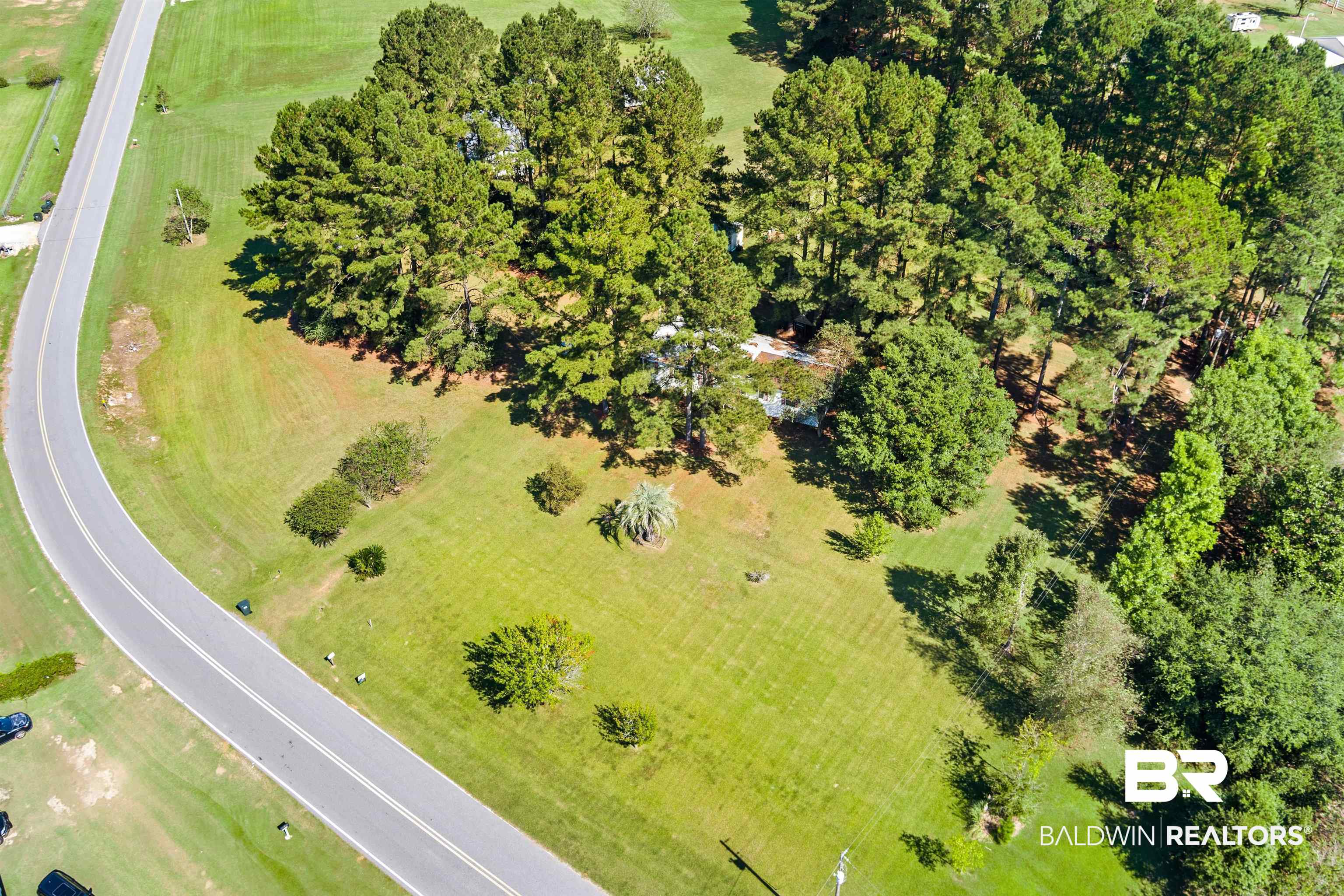 23700 Cumberland Road Robertsdale, AL 36567 - Photo 32 of 33 Drone / aerial view of a tree filled landscape