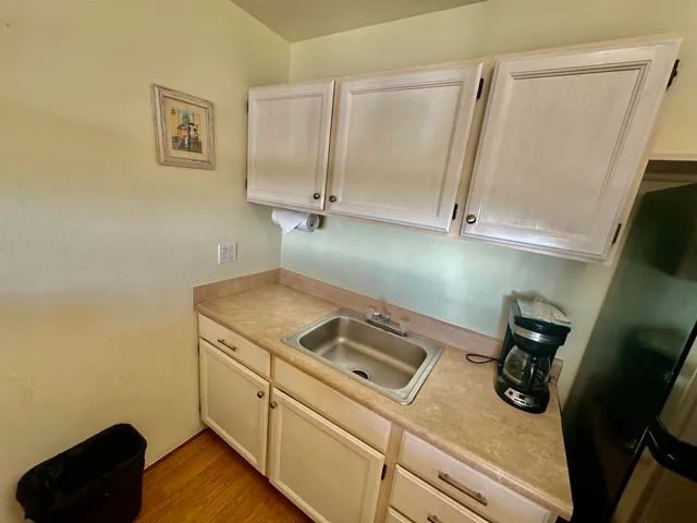 a utility room with sink dryer and washer