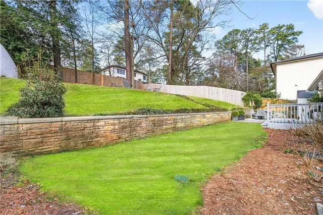 a view of a park with large trees