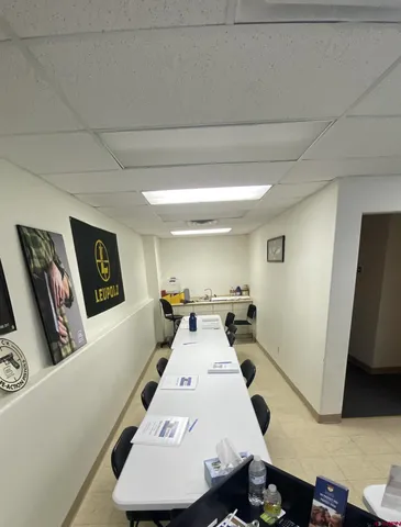 a view of kitchen with furniture and wooden floor