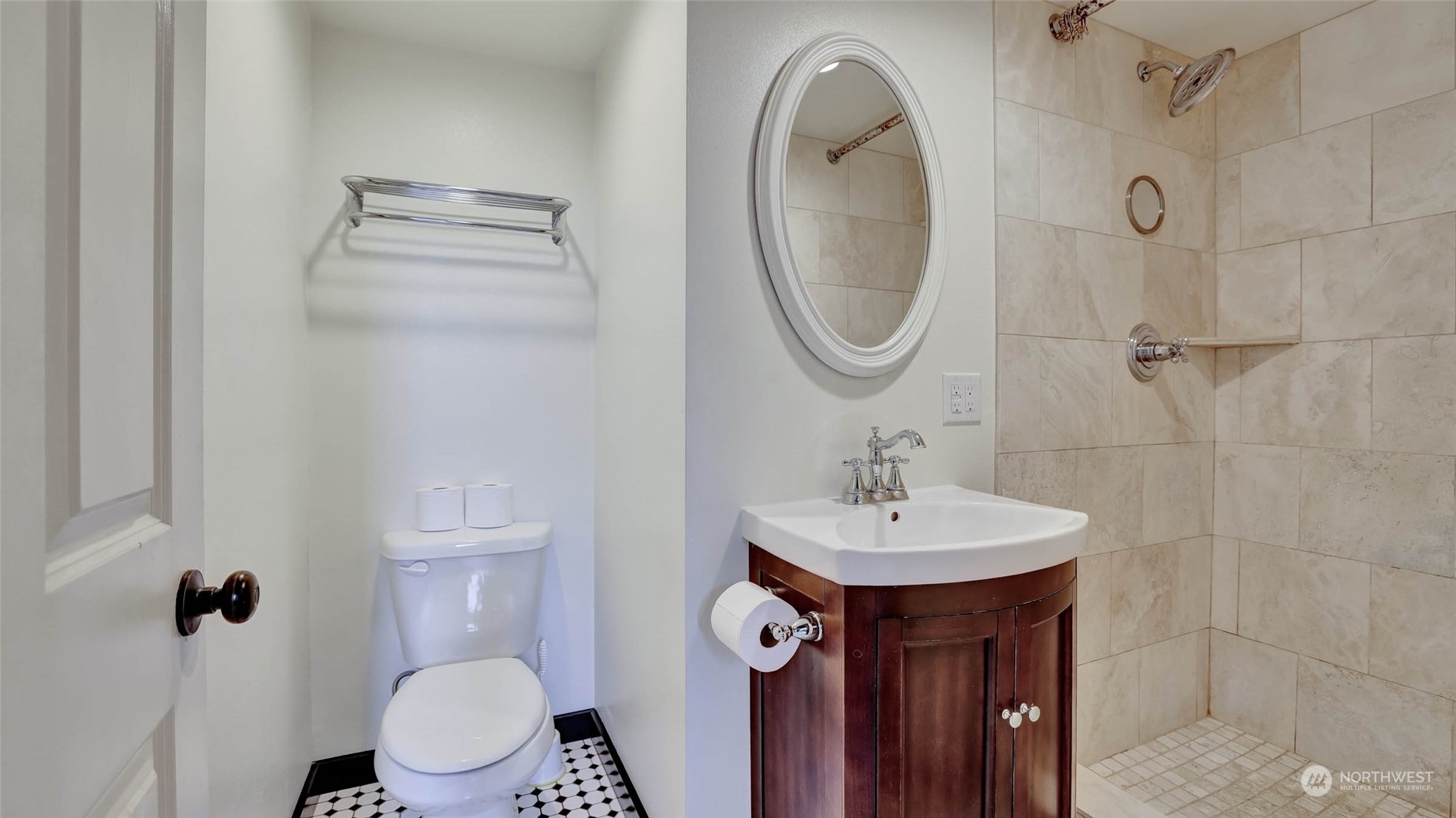 2131 Northeast 12th Street Renton, WA 98056 - Photo 21 of 37 a bathroom with a sink a toilet and a mirror