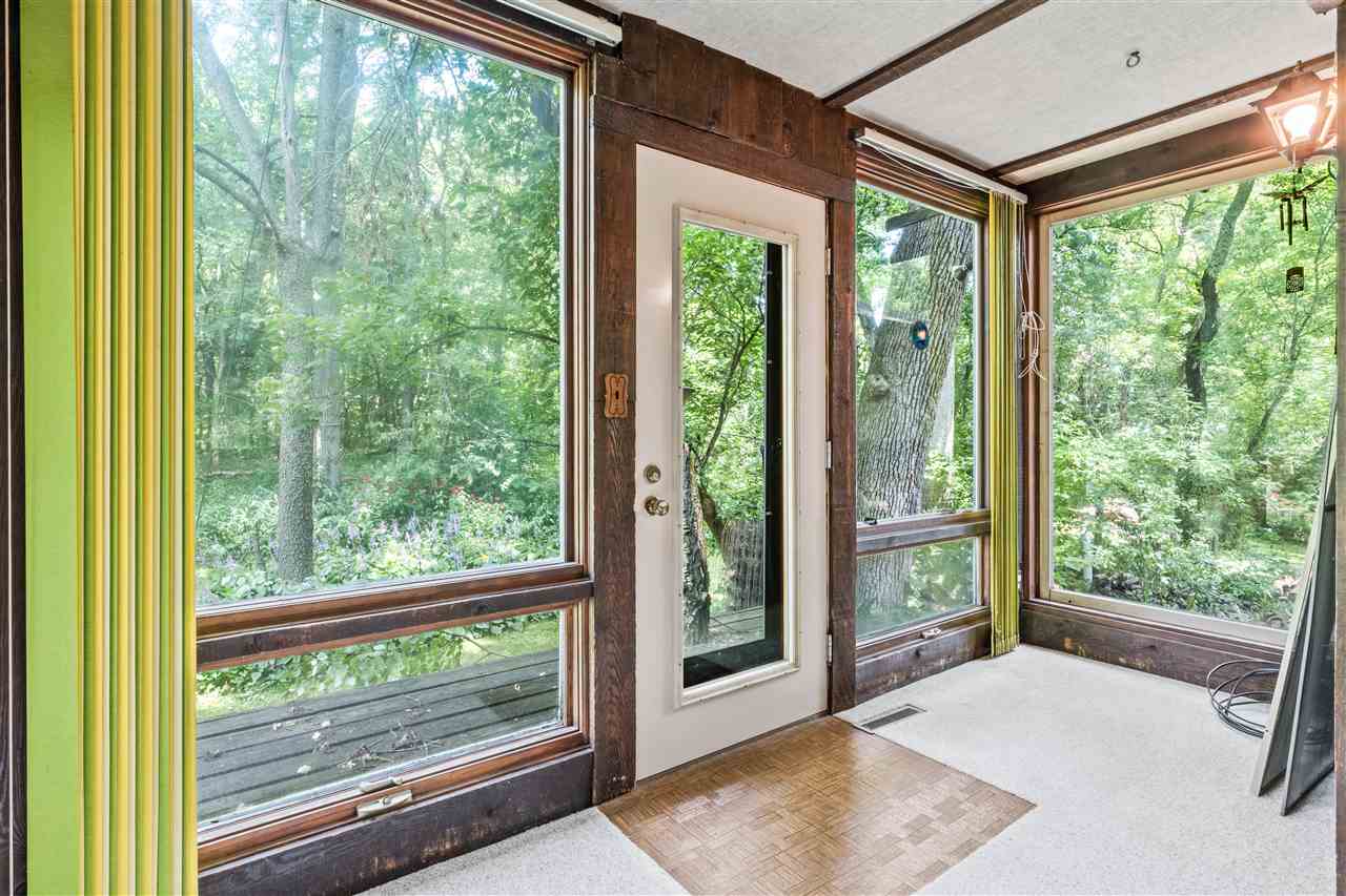 11064 Cemetery Road Capron, IL 61012 - Photo 12 of 40 a view of a room with wooden floor and windows