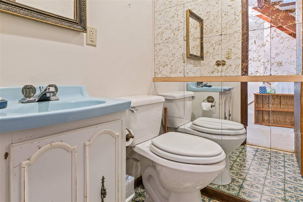 11064 Cemetery Road Capron, IL 61012 - Photo 17 of 40 a bathroom with a sink a toilet and shower