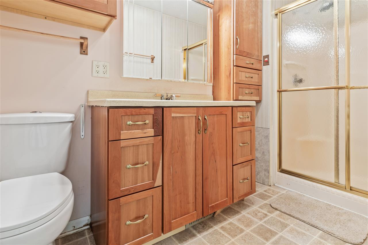 11064 Cemetery Road Capron, IL 61012 - Photo 20 of 40 a bathroom with a toilet a sink and a mirror