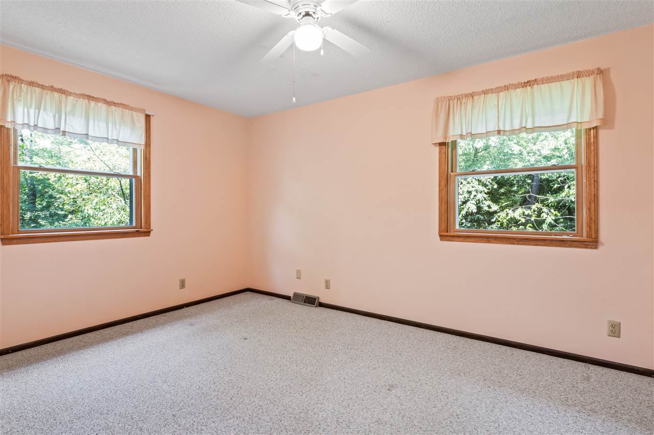 11064 Cemetery Road Capron, IL 61012 - Photo 21 of 40 an empty room with a window