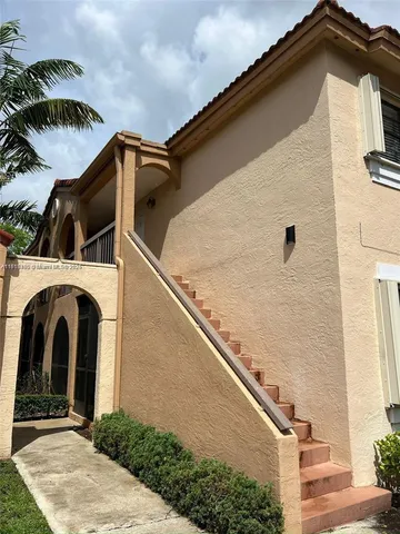 a view of the house with a yard