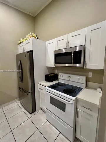 a kitchen with a stove and a microwave