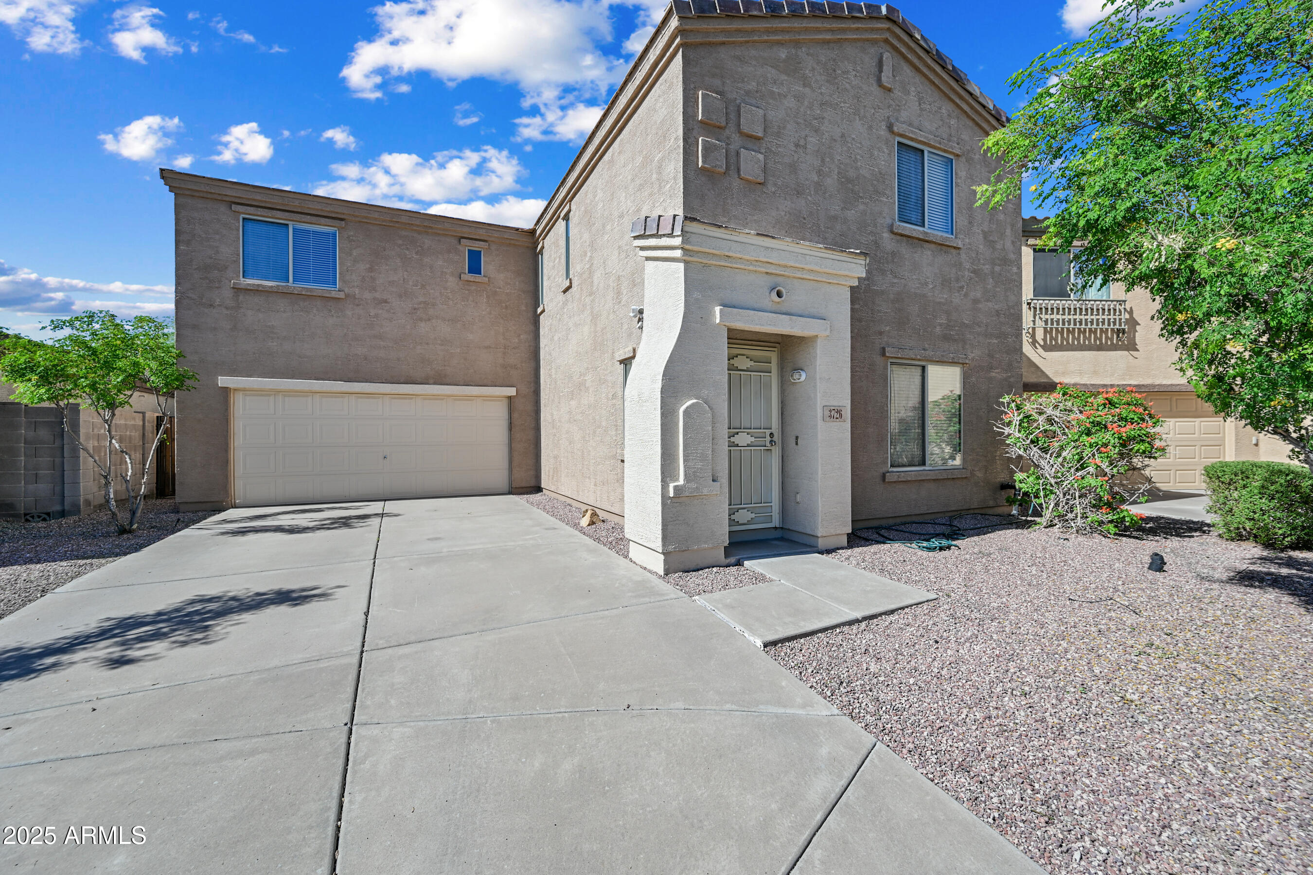 3726 West Pollack Street Phoenix, AZ 85041 - Photo 1 of 27 a front view of a house with a yard